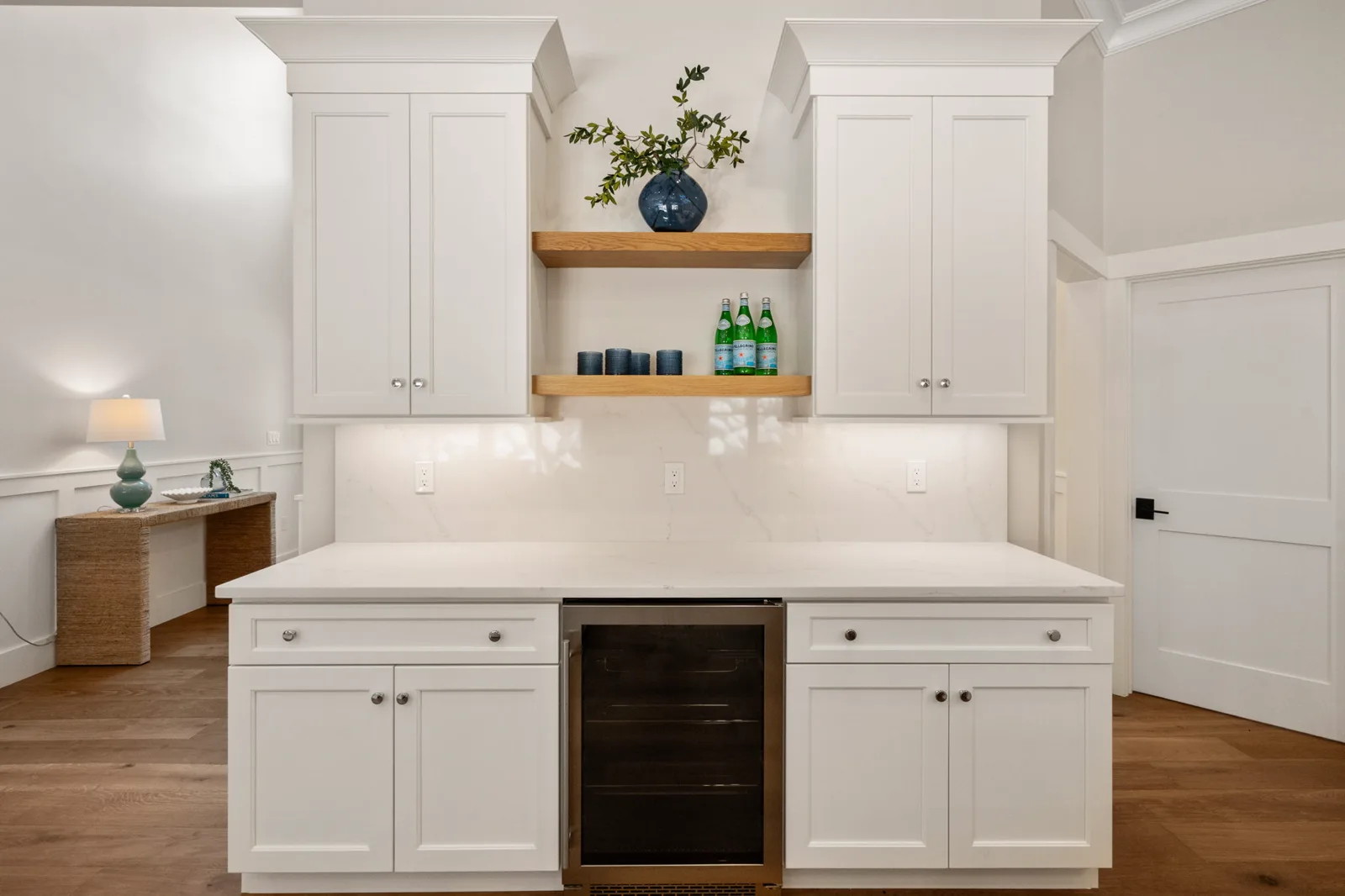 Built-in bar nook with beverage cooler and open shelf