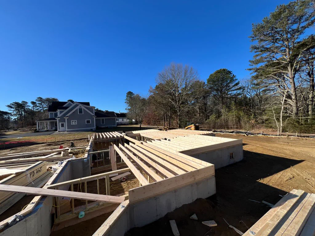 Foundation and first-floor deck framing at the Sandwich new build